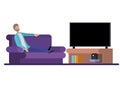 Young man seated in the sofa watching tv