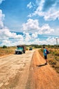 Young man self-locking device backpack points cap old cars locals reed Valley Vinales Road Gulf Mexico Cuba