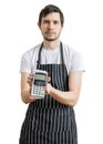 Young man - seller is passing payment terminal for paying with credit card. Royalty Free Stock Photo