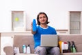 Young man selling cosmetics via internet