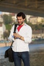 Young man sending text message on mobile phone Royalty Free Stock Photo