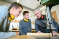 Young man and senior on woodwork apprenticeship Royalty Free Stock Photo