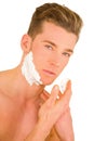 Young man shaving Royalty Free Stock Photo