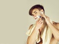 Young man shaving bearded face chin with safety razor