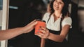 Young Man in Shirt Buying Coffee in Food Truck. Promenade in Town. Summer Day. Guy in Checkered Shirt. Street Food Concept. Cup of