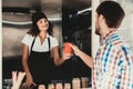 Young Man in Shirt Buying Coffee in Food Truck. Promenade in Town. Summer Day. Guy in Checkered Shirt. Street Food Concept. Cup of