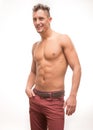 Young man shirtless pants body muscular model smiling Royalty Free Stock Photo