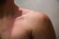 Close up shoulder of man which take a shower. Royalty Free Stock Photo