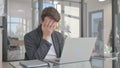 Young Man Shocked by Loss on Laptop in Office Royalty Free Stock Photo