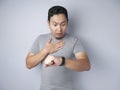 Young Man Shocked to See Wrist Watch, Late Concept Royalty Free Stock Photo