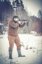 Young man shoots from a submachine gun Royalty Free Stock Photo