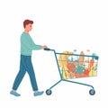 Young man with shopping cart full of food and drinks Royalty Free Stock Photo