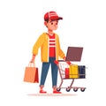 Young man with shopping cart and laptop. Online shopping concept. Vector illustration in cartoon style Royalty Free Stock Photo