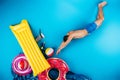 young man in shorts diving to various beach objects on blue summer Royalty Free Stock Photo