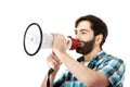 Young man shouting through megaphone. Royalty Free Stock Photo