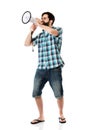 Young man shouting through megaphone. Royalty Free Stock Photo
