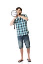 Young man shouting through megaphone. Royalty Free Stock Photo