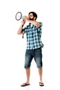 Young man shouting through megaphone. Royalty Free Stock Photo