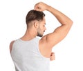 Young man showing armpit on white background Royalty Free Stock Photo