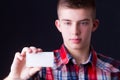 Young man showing blank business card Royalty Free Stock Photo