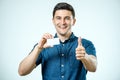 Young man showing blank business card or sign Royalty Free Stock Photo