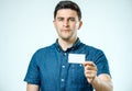 Young man showing blank business card or sign Royalty Free Stock Photo