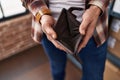 Young man showing empty wallet at office Royalty Free Stock Photo