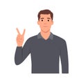 Young man showing peace sign. Trendy person making victory Royalty Free Stock Photo