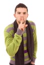Young man showing silence gesture with his finger Royalty Free Stock Photo