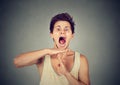 Young man showing time out hand gesture, frustrated screaming Royalty Free Stock Photo