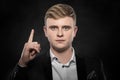 Young man shows finger up. Royalty Free Stock Photo