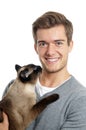 Young man with siamese cat Royalty Free Stock Photo