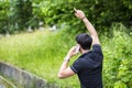 Young man on side of a road, calling and waiting Royalty Free Stock Photo