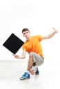 Young man with sign he is holding against a white background. Royalty Free Stock Photo