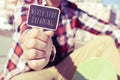 Young man with a signboard with the text never stop dreaming Royalty Free Stock Photo