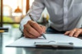 Young man signing an official document, male hand holding pen putting signature at paper contract agreement. Business, lawyer, Royalty Free Stock Photo