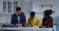 Young man signing property contract with his wife Royalty Free Stock Photo