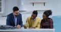 Young man signing property contract with his wife Royalty Free Stock Photo