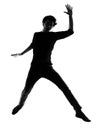 Young man silhouette jumping happy Royalty Free Stock Photo