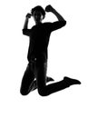 Young man silhouette jumping happy Royalty Free Stock Photo