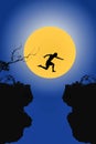 Young man in silhouette jumps between two cliffs on big moon ba