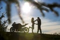 Young man in silhouette is kissing the hand of his girlfriend Royalty Free Stock Photo