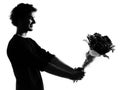 Young man silhouette offering flowers bouquet