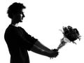 Young man silhouette offering flowers bouquet