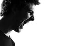 Young man silhouette screaming angry portrait