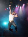 Young Man Singing And Jumping On Stage Royalty Free Stock Photo