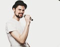 Young man singing with a microphone Royalty Free Stock Photo