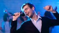 Young Man Singing Song Having Fun Partying At Night Club Royalty Free Stock Photo