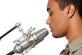 Young Man Singing into Vintage Microphone Royalty Free Stock Photo