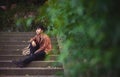 Young man sitting alone among the nature